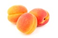 Three apricots isolated close-up Royalty Free Stock Photo