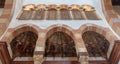 Three arches revealing three wooden domes decorated with floral patterns with interleaved wood window Mashrabiya, Beshtak palace Royalty Free Stock Photo