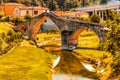 Three archs medieval bridge in Italy