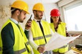 Three arhitects working together on construction site project Royalty Free Stock Photo