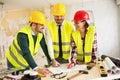 Three arhitects working together on construction site project Royalty Free Stock Photo