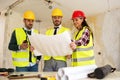 Three arhitects working together on construction site project Royalty Free Stock Photo