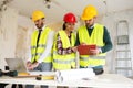 Three arhitects working together on construction site project Royalty Free Stock Photo