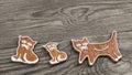 Cute baked gingerbread sweets. Cat shapes on wood background Royalty Free Stock Photo