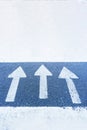 Three arrows on the blue surface of the asphalt point up, forward. Royalty Free Stock Photo