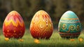 Three artistically painted Easter eggs in bright colors stand on green grass with a blurred background Royalty Free Stock Photo