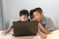 Three Asian Children Using Laptop At Home Royalty Free Stock Photo