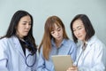 Three asian medical workers. Portrait of asian doctor. Chemists doing in the laboratory. young scientists with test and research Royalty Free Stock Photo