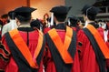 Three Asian university graduates Royalty Free Stock Photo