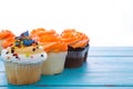 Three assorted iced cupcakes in a row Royalty Free Stock Photo