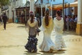 Three attractive young women in traditional feria dress