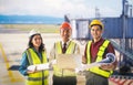 Three Aviation technician standing with Airport Runway and Bridge in the background