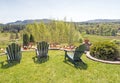 Adirondack chairs on grass lawn overlooking Berkshires in Spring Royalty Free Stock Photo