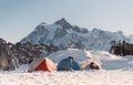 Backpacking tents on the peaks of the glacier Range Mount Baker. Mount Shuksan in the background