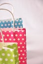 Three bags colored on table white Royalty Free Stock Photo