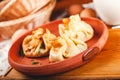 Three bags of thin pancakes crepes, blini with filling. Traditional Maslenitsa festival meal