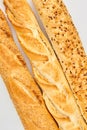 Three baguettes on white background.