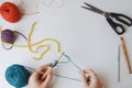 Hands crocheting at craft table Royalty Free Stock Photo