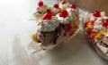 Three banana split sundaes on a faded white background, close up side view. Copy space.