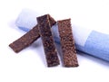 Three bars of flax seeds lying on the towel.