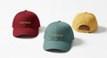 Three colorful baseball caps with embroidered text on a white background Royalty Free Stock Photo