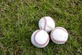 Three Baseballs in Grass