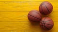 Three basketballs on a yellow table with one ball in the middle, AI