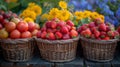 three baskets filled with strawberries , tomatoes , and sunflowers are sitting on a wooden table Royalty Free Stock Photo