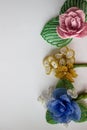 Three beaded flowers on a white background. Royalty Free Stock Photo