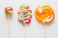 Three beautiful colorful lollipops on sticks