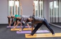 Three beautiful girls and man do yoga in the center of yoga and spa. Royalty Free Stock Photo