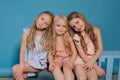 Three beautiful little girls dresses fashion portrait sisters