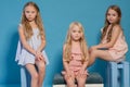 Three beautiful little girls dresses fashion portrait sisters