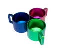 Three beautiful metal colored cups. Cups with anodized coating. 3D illustration. Royalty Free Stock Photo