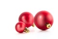 Three beautiful red Christmas balls isolated on white background. Studio shot closeup Royalty Free Stock Photo