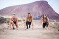 Three beautiful runner girls young ready to start and run for hard workout and fitness outdoor activity. build your new and strong Royalty Free Stock Photo