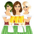 Three beautiful waitresses holding beer mugs for oktoberfest party toasting wearing a dirndl