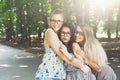 Three beautiful young boho chic stylish girls walking in park. Royalty Free Stock Photo