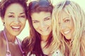 Three Beautiful Young Women Friends Laughing At The Beach