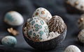 Three beautifully decorated eggs in a bowl, featuring gold and blue designs for Easter celebrations. Royalty Free Stock Photo