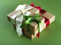 Three beautifully packed presents on the green background.