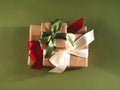 Three beautifully packed presents with the satin ribbons and craft paper.