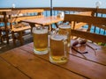 Three beer mugs on the table Royalty Free Stock Photo