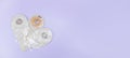 Three beige colostomy bags lie on a light lilac background . Royalty Free Stock Photo