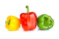 Three bell peppers: red, green and yellow, isolated on a white background. Close up