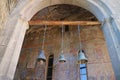 Three of Bells and Medieval Mural on the Facade of Church of the Assumption at Vardzia Cave City on Erusheti Mountain, Georgia Royalty Free Stock Photo