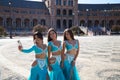 Three belly dancers are taking a photo with their mobile phones. They are dressed in light blue and are having fun. Concept of