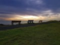 Three benches at the seaside background Royalty Free Stock Photo