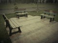 Three benches in lawn of park Royalty Free Stock Photo