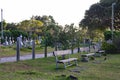 Three benches in the traditional cemetery with coast view of Cap Malheureux, Mauritius island